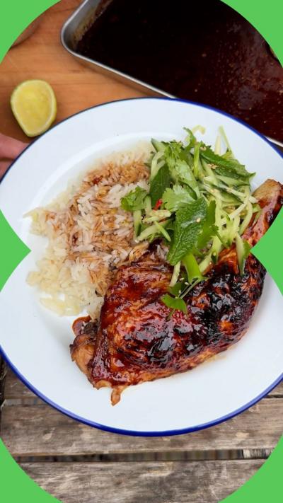 Rice, meat and cucumber on a white plate