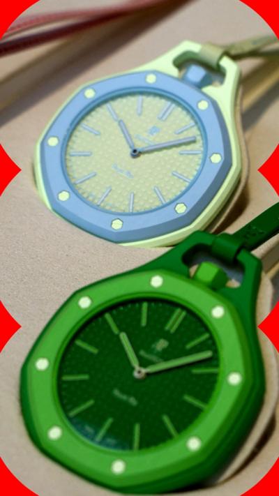 A close up shot of two colourful watch faces