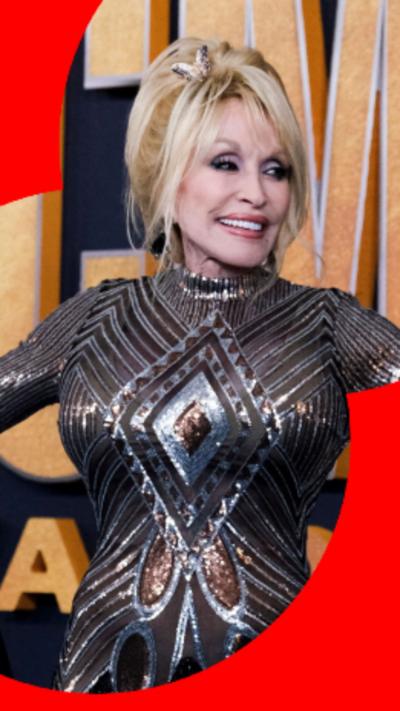 Image of Dolly Parton wearing a silver and bronze dress.