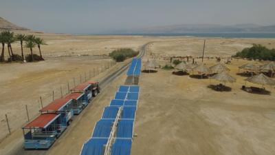 A train that is used to ferry guests from a hotel that once sat on the shore of the Dead Sea