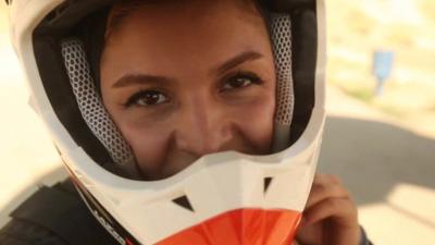 Girl in motorbike helmet