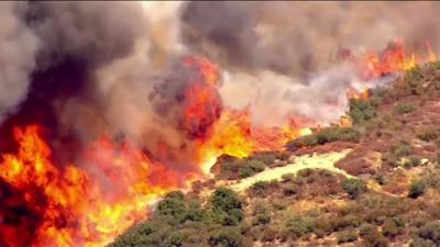 A brush fire in Devore, California.