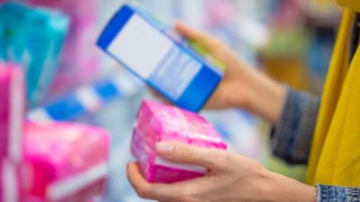 Woman holding sanitary products