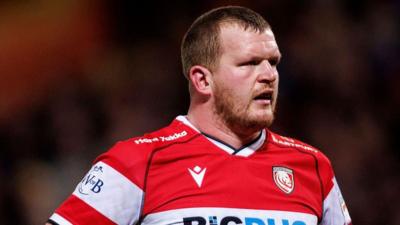 Will Crane standing on the pitch with his arms on his hips during Gloucester v Bath