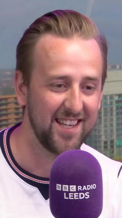 Harry Kane lookalike Danny Bullen wears an England shirt and smiles