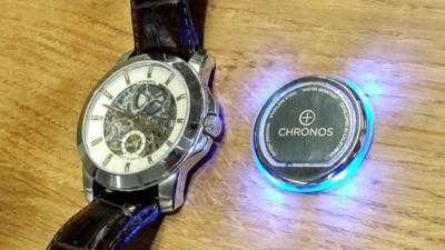 Chronos pad next to a watch