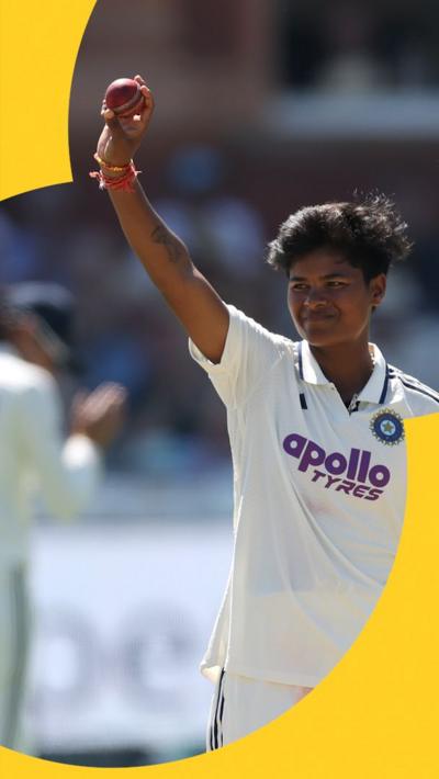 Kranti Gaud holding the ball in the air for her five wickets
