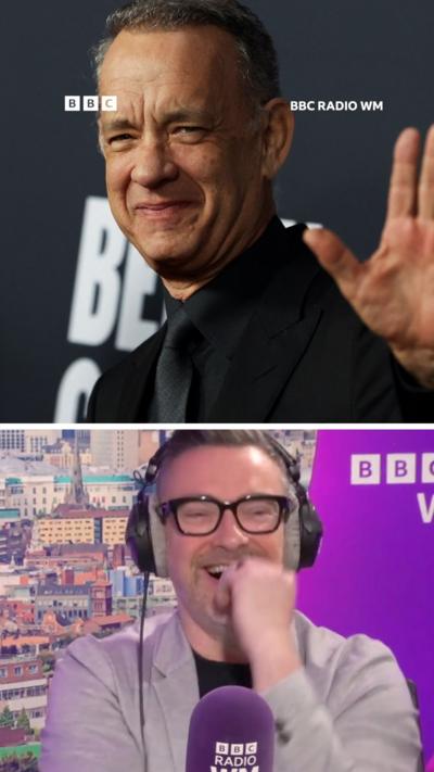 Split screen view. Bottom half presenter ed james, wearing a grey blazer, headphones and glasses in a radio studio. Top half is actor tom hanks, one hand waving, smiling towards camera, wearing black shirt, tie and blazer.