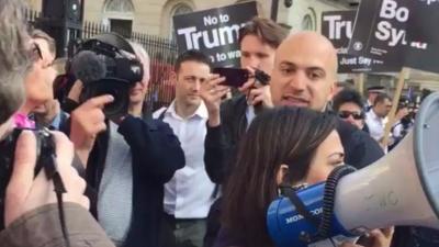 Hassan Akkad talks to Stop the War protestors outside Downing Street