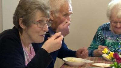 People eating at the community cafe