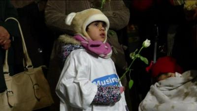 Child at Muslim vigil in Berlin