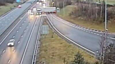 A lorry dangerously attempts to rejoin motorway