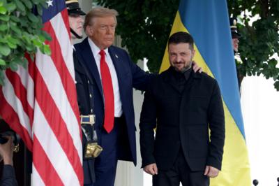 President Donald Trump greets Ukrainian President Volodymyr Zelensky and puts an arm around him.