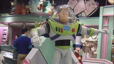 A giant Buzz Lightyear in a toyshop.