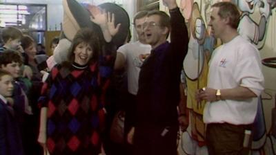 Maggie Philbin and a group of people attend the unveiling of a new mural at Alder Hey Children's Hospital