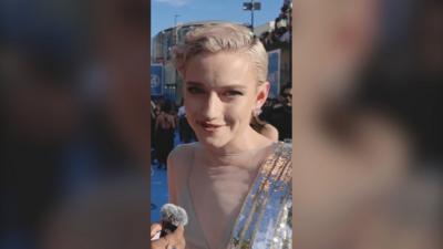 Julia Garner, with short blonde hair and silver sequins, at the Fantastic Four premiere