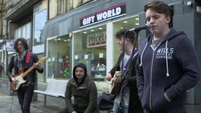 Musicians performing in Paisley High Street