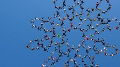 Skydivers in flower formation