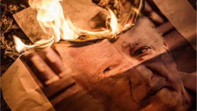 Image of Fethullah Gulen which has been set on fire