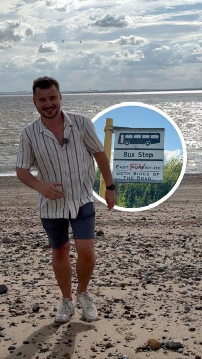 A man on a beach, with a bus stop sign insert.