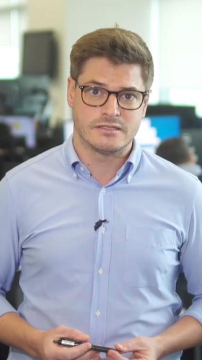 Nick Marsh in a blue shirt and wearing glasses