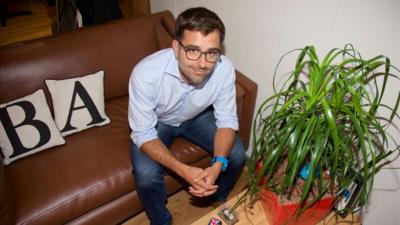 BlaBlaCar co-founder sitting on a sofa in the company's London office