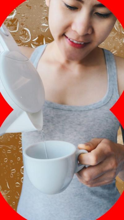 Woman wearing a grey vest top, pours water from a kettle into a mug