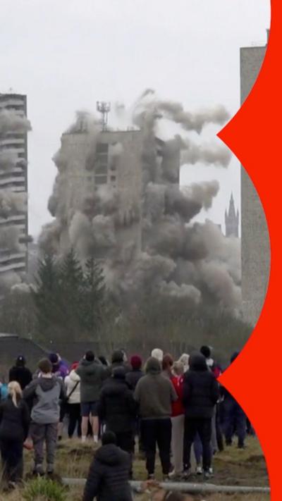 A building collapses during a controlled explosion