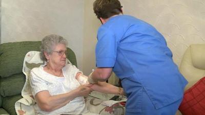 Patient Della Davies says she wants to be treated as much as possible at her home in Llanelli.