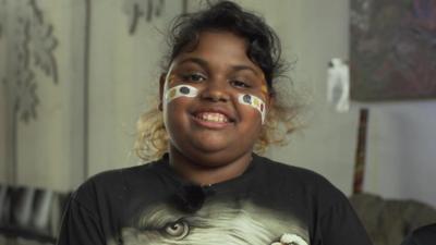 Kids in Australia show Newsround around an Aboriginal cultural centre