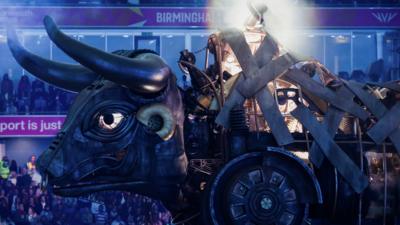 side angle of an animatronic bull with massive horns in birmingham's alexander stadium