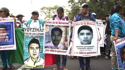 Relatives of 43 missing students lead a protest in Mexico City