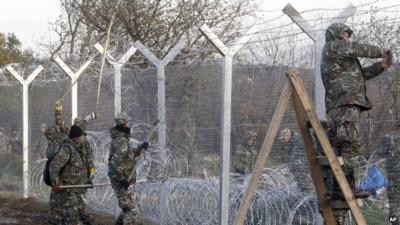 Soldiers erecting border fence