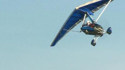 Microlight flies through the air