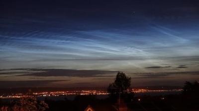 Noctilucent clouds in a night sky