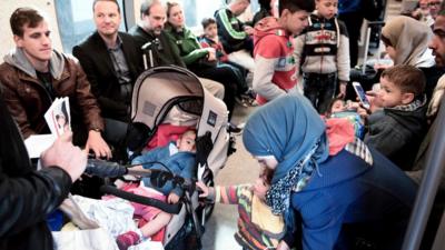 Migrants sitting on a train in Copenhagen on September 10, 2015.