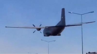 Plane flies over motorway