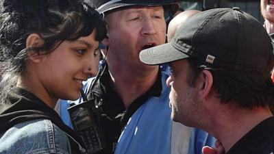 Woman smiling at protester