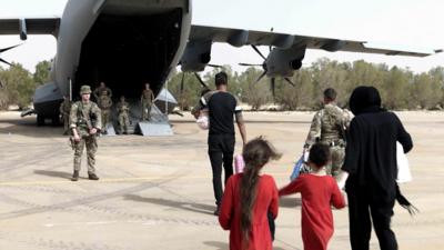 People boarding plane.