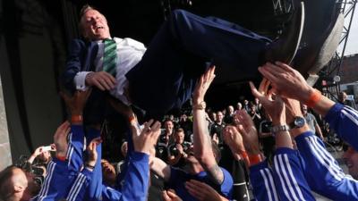 Northern Ireland players give manager Michael O'Neill the 'bumps' at the homecoming event at Titanic Quarter in Belfast