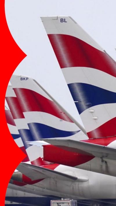 A row of British Airway plane tails.