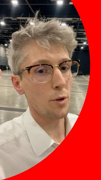 BBC political reporter Sam Francis wearing glasses and white shirt