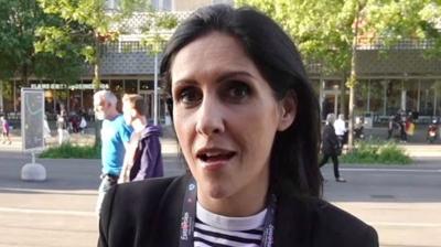 BBC News presenter Maryam Moshiri speaks to the camera while standing outside, with a UK flag graphic embedded onto the image.