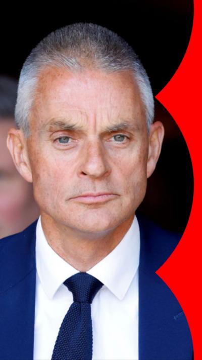 Tim Davie wearing blue tie and suit