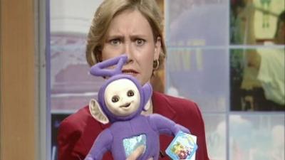 Presenter holding a Tinky-Winky toy