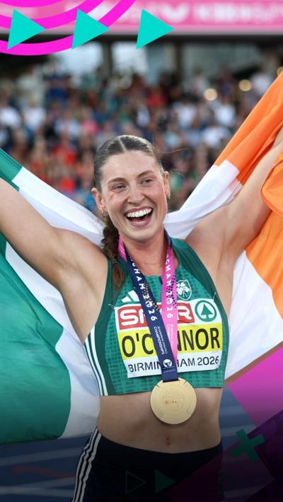 Kate O'Connor celebrates with her gold medal round her neck and the flag of Ireland in her arms