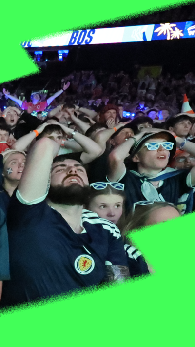 Scotland fans in crowd wearing Scotland football tops