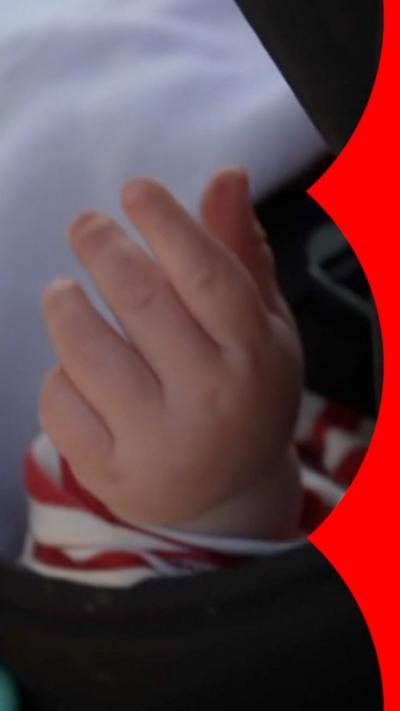 Newborn baby's hand.