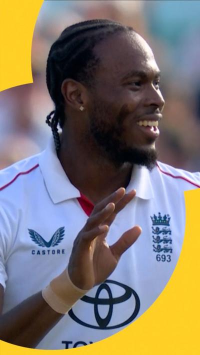 Jofra Archer smiles at teammate