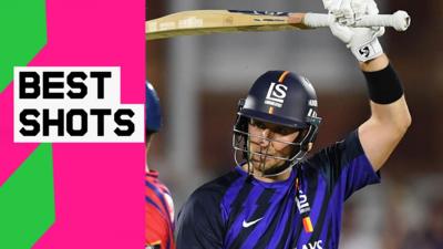 Liam Livingstone holds his bat above his head